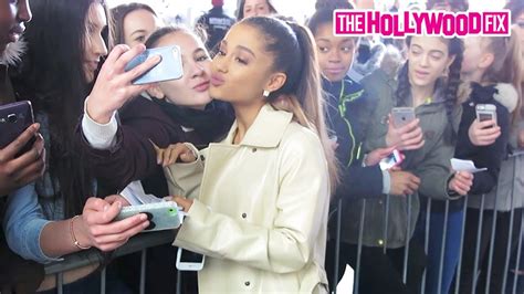 Ariana Grande Kisses Her Biggest Fans And Signs Autographs While Leaving