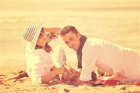 Young Couple Enjoying Picnic On The Beach 12644539 Stock Photo At Vecteezy