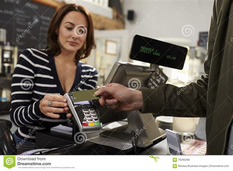 You can pay with cash or check at any branch of your credit card provider. Customer Making A Contactless Card Payment Over Shop Counter Stock Photo - Image of person, part ...