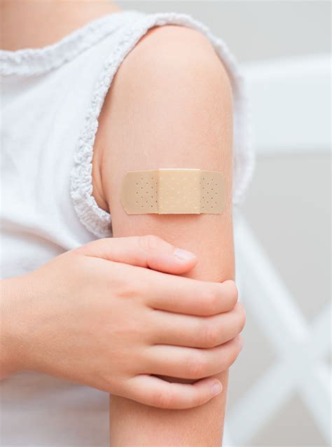 Child Arm With An Adhesive Bandage Pharmamum