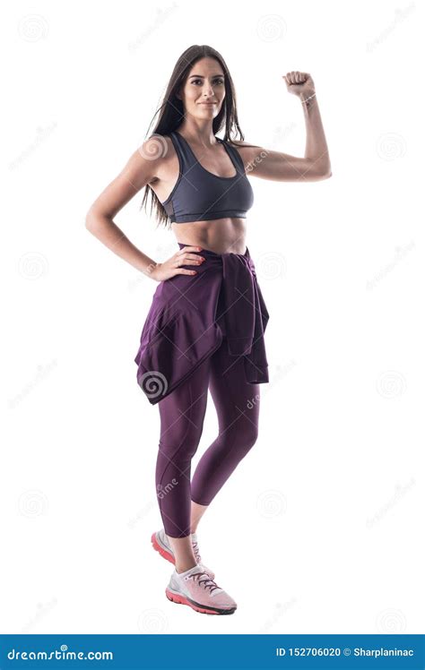 Motivated Young Fit Healthy Attractive Woman Flexing And Showing Bicep