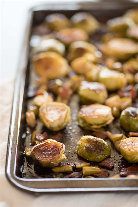 In a small bowl, whisk oil, vinegar, brown sugar and curry roast for 45 minutes, gently stirring halfway through cooking time. Roasted Brussels Sprouts with Bacon and Apples - Wholefully