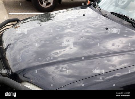 Hailstone Damage Bonnet Of A Vehicle Damaged By Giant Hailstones