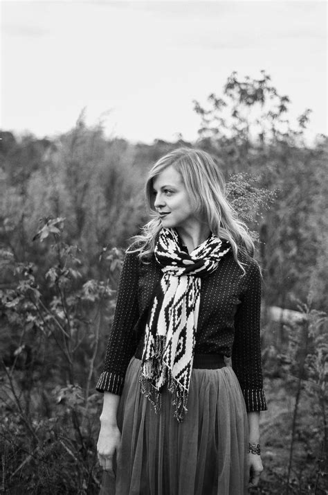 Black And White Portrait Of A Beautiful Blonde Woman Standing In A
