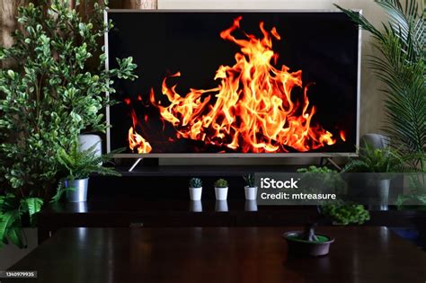 Closeup Image Of Smart Television Screensaver Of Roaring Dancing Flames