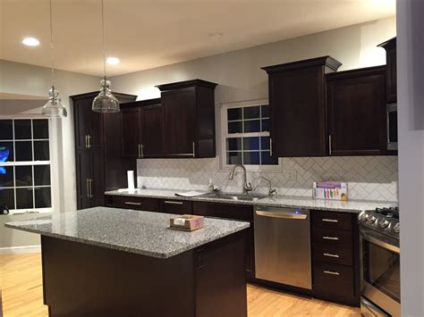 Hours may change under current circumstances Dark cabinets Kraft maid subway tile azul platino granite ...