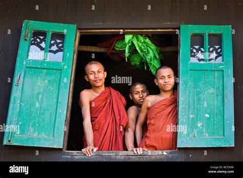 Myanmar Burma Rakhine State Sittwe Three Novice Monks Look Out Of