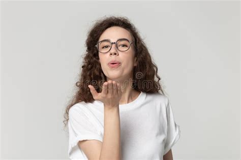 Head Shot Portrait Attractive Woman In Eyeglasses Sending Air Kisses