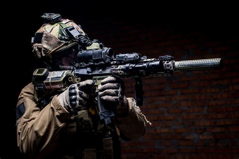 Spec Ops Soldier In Uniform With Assault Rifleman In Military Uniform