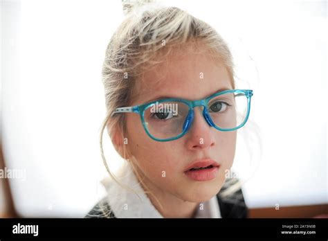 Cute Crying Little Girl In Glasses With Face Wet Of Tears Stock Photo