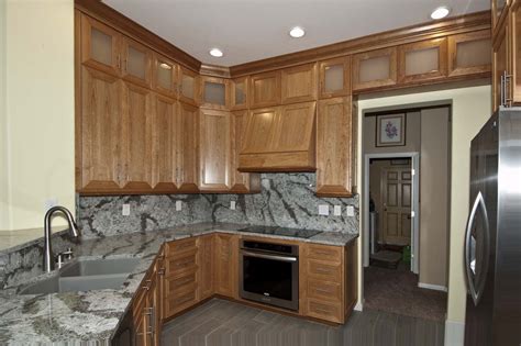 If your cabinets are really grimy, let the cleaner sit for up to 10 minutes after spraying. Cherry Wood Kitchen | Unique Design Cabinet Co