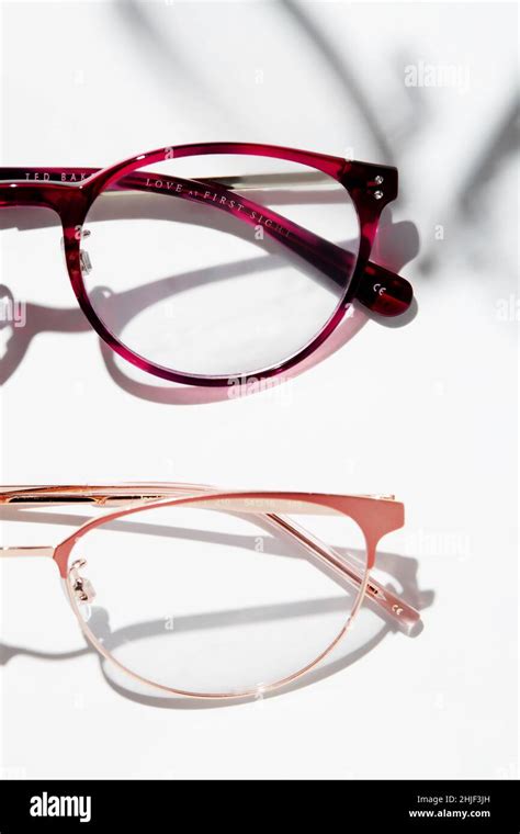 A Photo Showing Part Of Two Eyeglasses Of Different Frame Colors Isolated On White Background