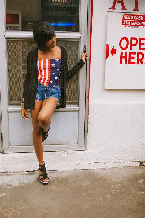 Black Girl Standing In Front Of Door By Stocksy Contributor