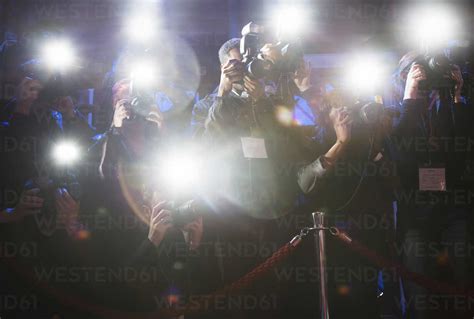 Paparazzi Using Flash Photography At Red Carpet Event Stock Photo