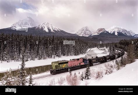 A Canadian Pacific Freight Train At Morants Curve In Winter Along The