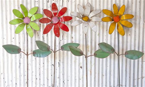 Put the bike sprocket there to drive. Recycled Tin Colorful Flowers Yard Stakes