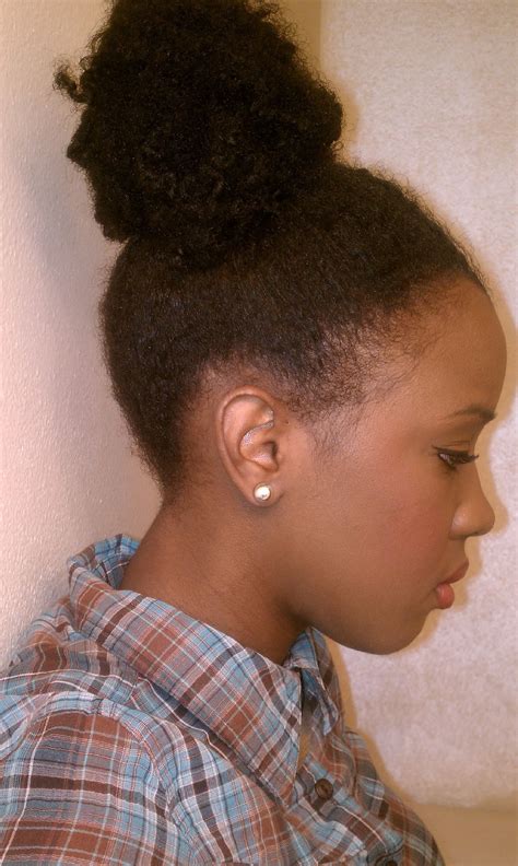 A bun at the top of your head is always a great idea. Curly Updos For Black Hair | Spefashion