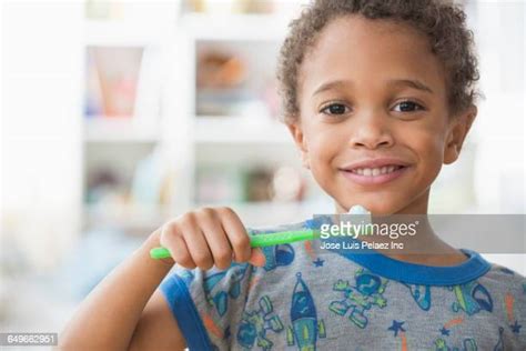 Black Boy Brushing Teeth Photos And Premium High Res Pictures Getty