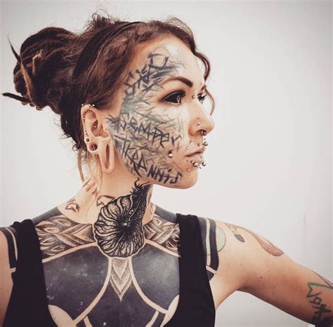 Woman With Tattoos And Piercings