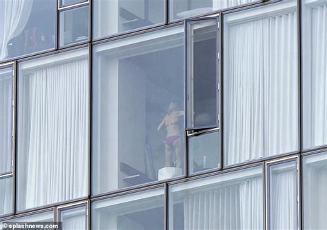 Room With A View Exhibitionist Couple Are Caught Cavorting In NYC Hotel Window As Photographer