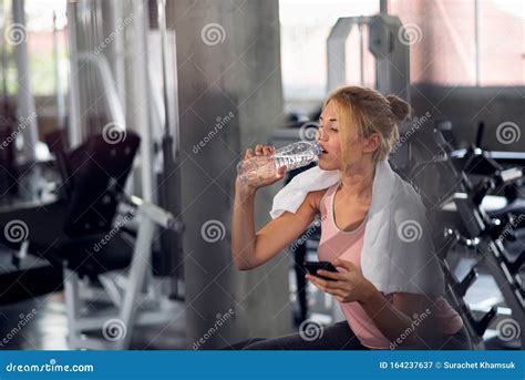 Fitness Woman Drinking Water From Bottle In The Gym Stock Image Image