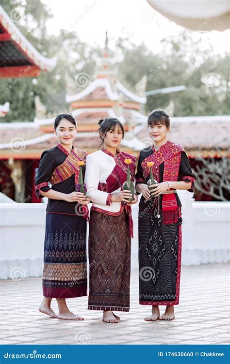 Three Thai Girl In The Phu Thai Tribe Standing In The Thai Temple Area