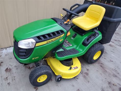 Like New John Deere E120 Ridding Tractor With Bagger For Sale In Dyer