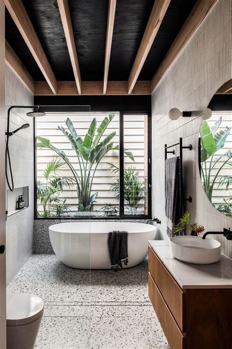Bathroom With Timber Ceiling And Terrazzo Tiles Framing The Greenery
