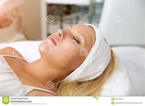 Process Cosmetic Mask Of Massage And Facials In Beauty Salon Cosmetologist Removes Dead Skin