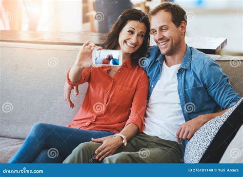 Smile Honey Cropped Of An Affectionate Couple Taking Selfies On The