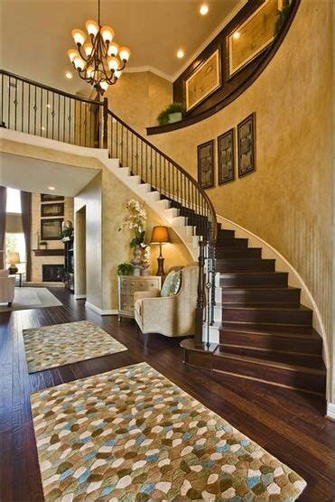 You can always decorate this area with photos of the family but if you want to be adventurous, then go with useful and creative diy ideas to try and make things interesting. Nice curving stair case. | Staircase decor