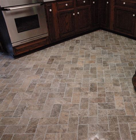 Natural stone flooring options include marble, granite, slate, limestone, travertine, and sandstone. Custom Bathroom Remodeling: Natural Stone Herringbone Tile Floor