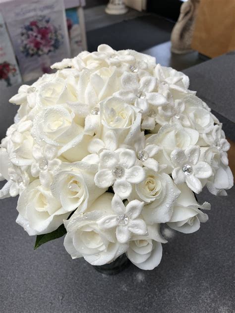 Priscillas Bouquet White Roses And Stephanotis Handheld