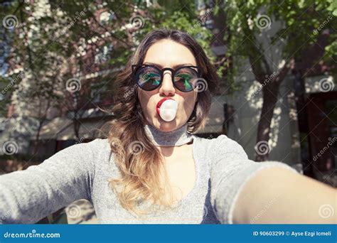Young Beautiful Woman Taking Self Portrait Selfie Outdoors Stock Image