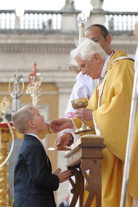 How Not To Receive The Eucharist While Holding A Baby Illustrated