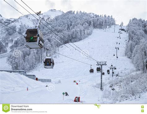 Cableway Ski Lift Cabins On Snowy Mountain Background