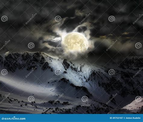 The Full Moon In The Sky Over The Mountain Snow Peak Stock Image