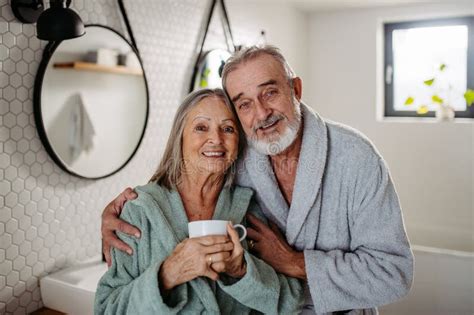 senior couple having morning routine in their bathroom stock image image of home standing