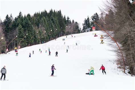 People Having Fun Skiing On Snowy Mountain Editorial Photography