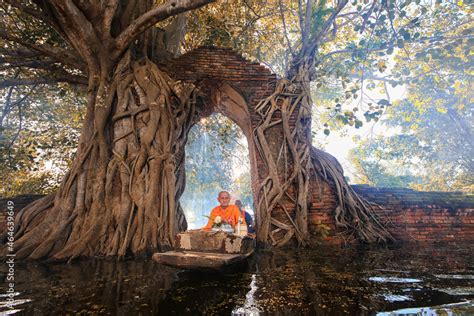 Monk Transport By Boat Pass Ancient Temple During Flood In Ayutthaya