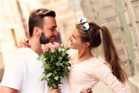 Happy Romantic Couple With Flowers Stock Photo Image Of Roses