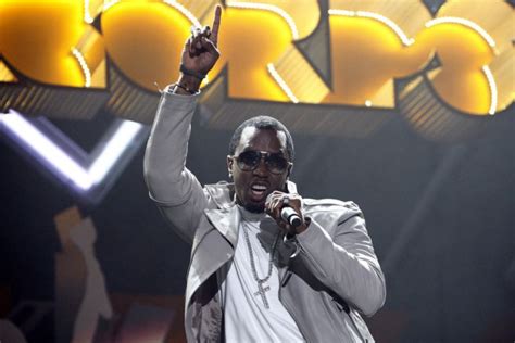 Diddy Passes Out Dollar Bills Outside Of Magic City In Atlanta