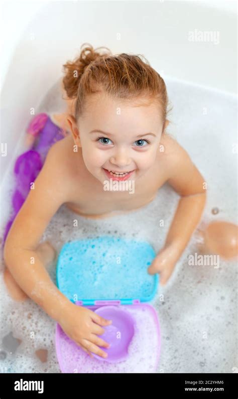 Cute Adorable Baby Girl Taking Foamy Bath In Bathtub Toddler Playing