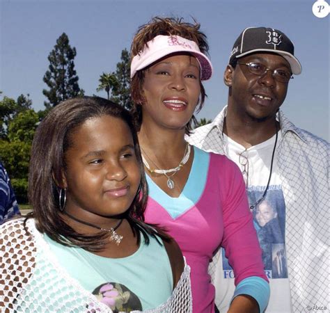 Whitney Houston Son Ex Mari Bobby Brown Et Leur Fille Bobbi Kristina à Disneyland Le 7 Août