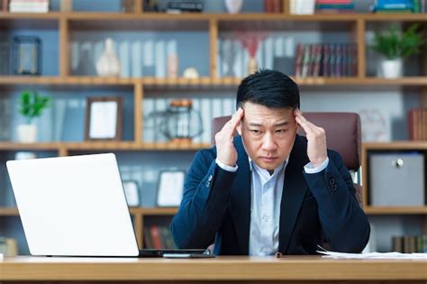 Premium Photo Asian Businessman Working In The Office Holding Hands