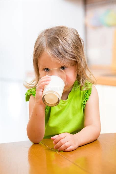 Baby Girl Drinking Milk From Bottlee Without Help Stock Image Image