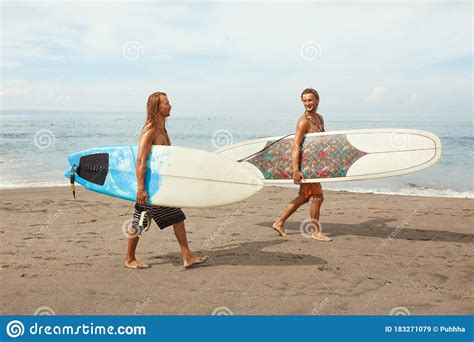 Surfing Young Surfers With Surfboards Smiling Handsome Men Walking On