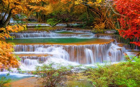 Thailand Kanchanaburi Cascade Waterfall In Autumn Trees With Autumn Red And Yellow Leaves