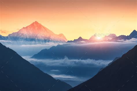 Mountains And Low Clouds At Sunrise In Nepal Stock Photo By Den Belitsky
