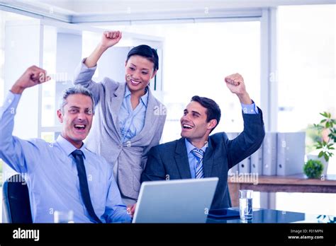 Happy Business People Cheering Together Stock Photo Alamy
